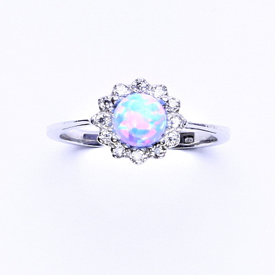 Zlatý prsten, bílé zlato, světle modrý syntetický opál, čiré zirkony, T 1495